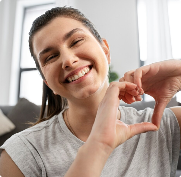 Girl making peace sign