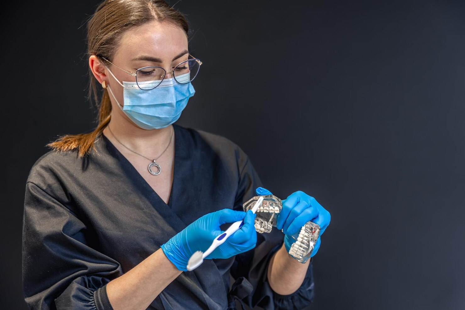Nurse cleaning aligners